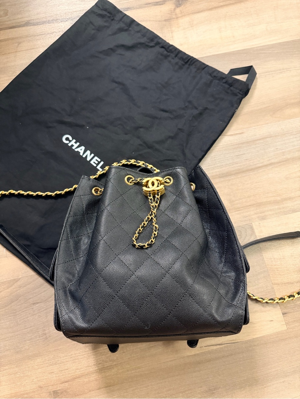 CHANEL Black Quilted Caviar Leather Drawstring Backpack with Gold Chain CC